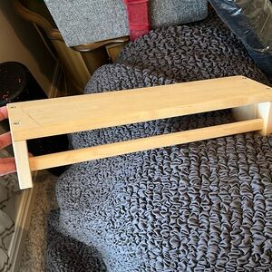 Raw wood shelf with towel bar